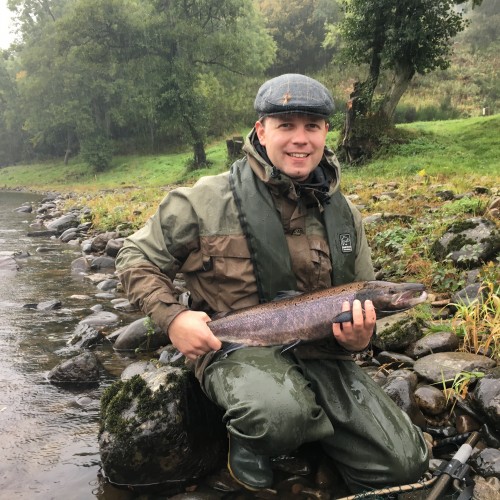 Poor rising water conditions via prolonged heavy rainfall didn't stop the smile from this happy Austrian salmon fisher holding this Autumn River Tay salmon that he'd just landed on the fly at the Trap Pool on the Newtyle salmon beat near Dunkeld.