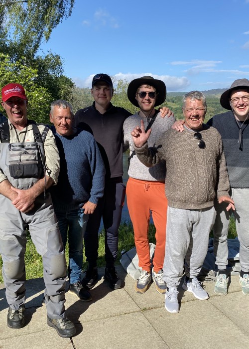 Here's a great group of River Tay guided salmon fishing guests with 2 top professional Tay salmon guides of ours posing for a group shot directly outside the Kinnaird Beat fishing hut which is 15 minutes from Dunkeld.