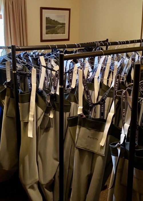 As a professional salmon fishing guide you need to hold all of the required salmon fishing kit for visiting salmon fishers. Here's a few rails of Ocean chest waders that are drying out after large fishing party event on the River Tay near Dunkeld.
