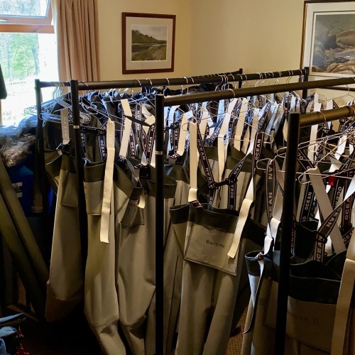 As a professional salmon fishing guide you need to hold all of the required salmon fishing kit for visiting salmon fishers. Here's a few rails of Ocean chest waders that are drying out after large fishing party event on the River Tay near Dunkeld.