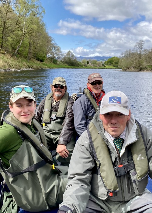 Here's a boat load of River Tay salmon fishing guests with their personal guide motoring up through the Channel Pool on the Upper Kinnaird Beat near Aberfeldy. You can see from the lack of full foliage on the riverbank trees that this shot was taken during mid May.