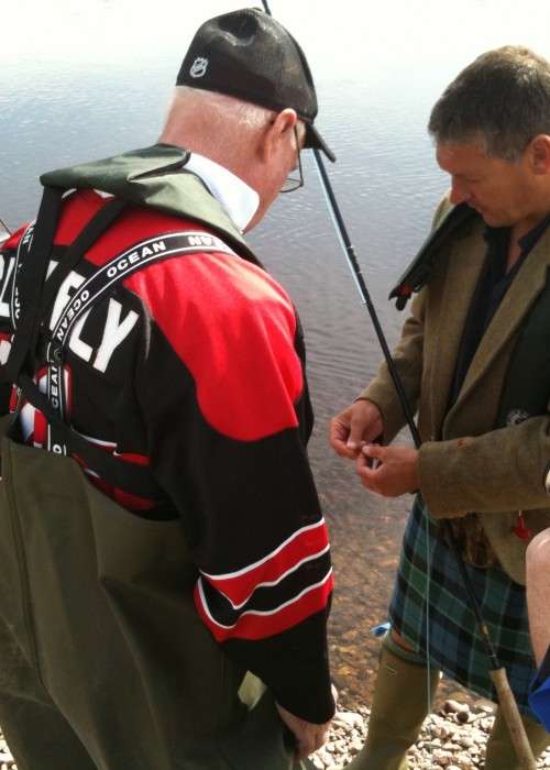 Here's Jock Monteith out showing a group of visiting Canadian salmon fishers how we tie on a salmon fly in Scotland. This shot was taken on the left hand bank of the Gean Tree Pool of the River Tay near the village of Murthly.