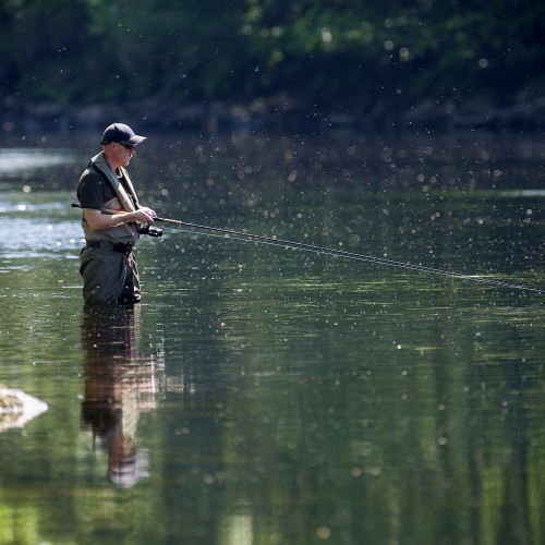 Here's a spin fisher out covering a deep water slow flow channel near Dunkeld in Summertime. Salmon take up deep holding positions in Summer when the river temperature is warm and a fast sinking spinner can often be perfect for getting down onto these fish.