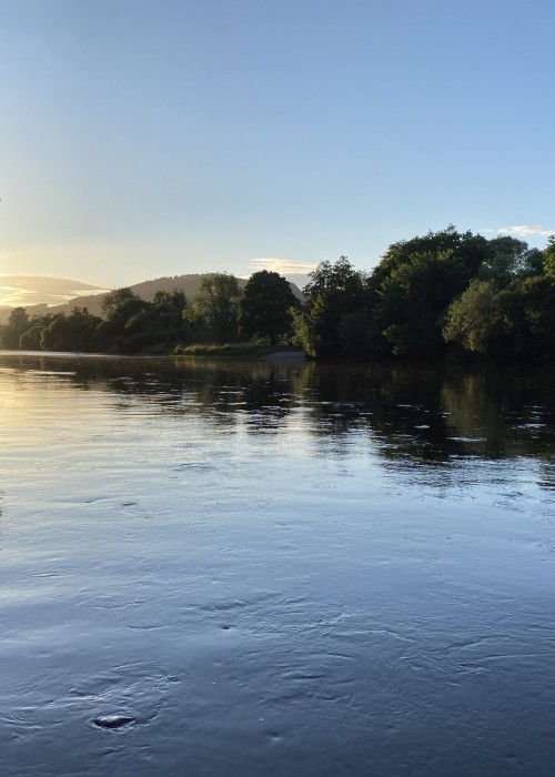 This is the tail of the Rock Pool on the River Tay near Dunkeld at dusk. You can see that the sun has just dipped down behind the Perthshire hills and the light is starting to fade.