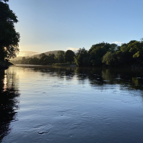 This is the tail of the Rock Pool on the River Tay near Dunkeld at dusk. You can see that the sun has just dipped down behind the Perthshire hills and the light is starting to fade.