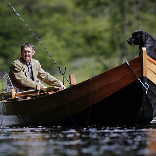 Top Glasgow based photographer Peter Sandground took this superb shot of me and my black labrador dog 'Selkie' on the River Tay near Dunkeld.